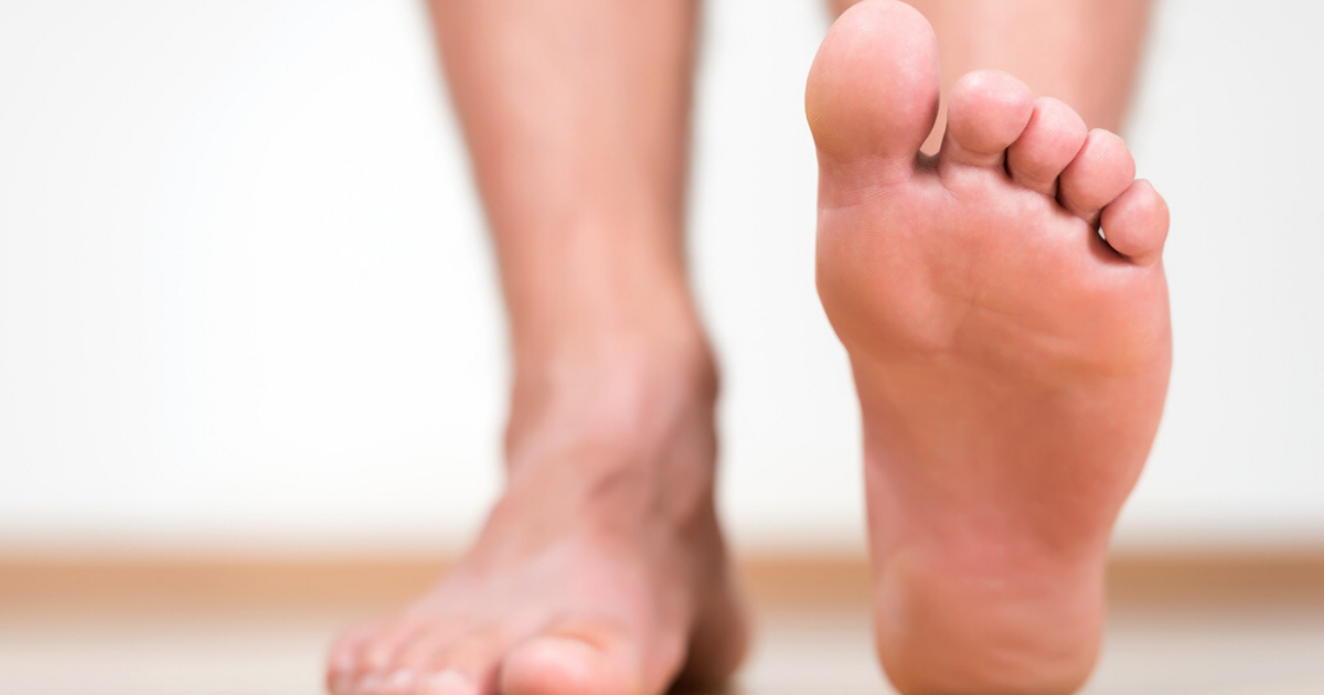 Foot lifted off the floor of person who successfully finished athletes foot treatment by being consistent 