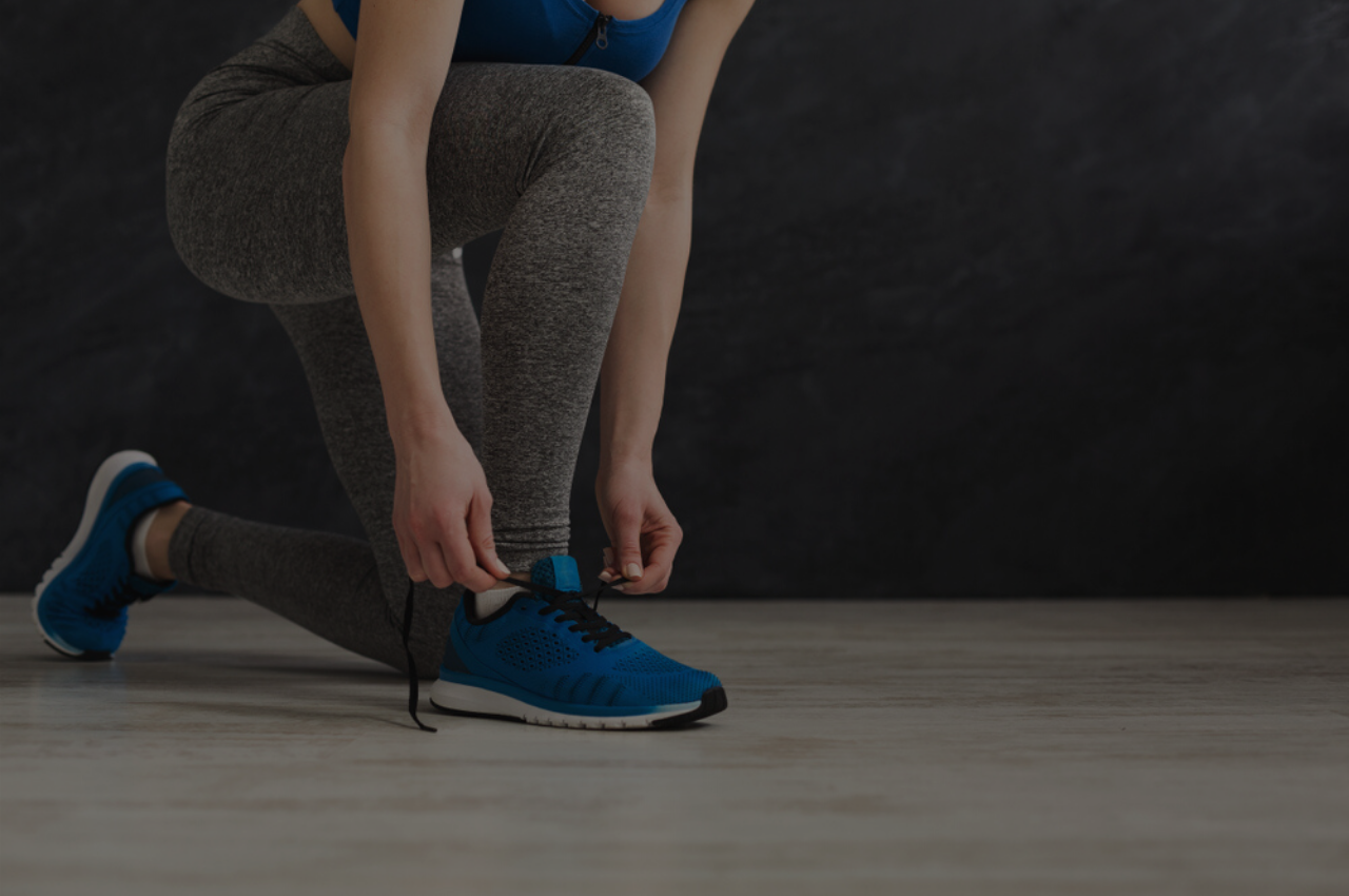 woman with athletes foot tying shoes wondering if Silka Cream is the right treatment for her