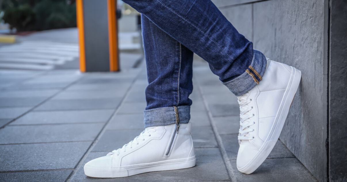 man stopping his sweaty feet by wearing clean shoes and fresh socks