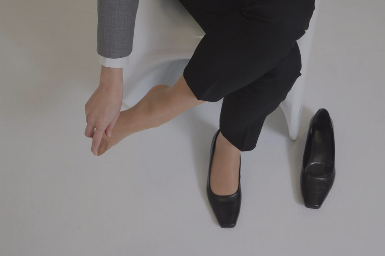 woman with irritating athletes foot wondering how to incorporate athletes foot prevention tips into her office routine woman with irritating athletes foot wondering how to incorporate athletes foot prevention tips into her office routine