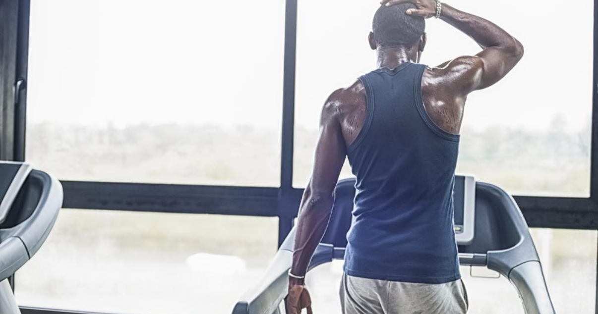 man at the gym wondering how to prevent athletes foot when exercising