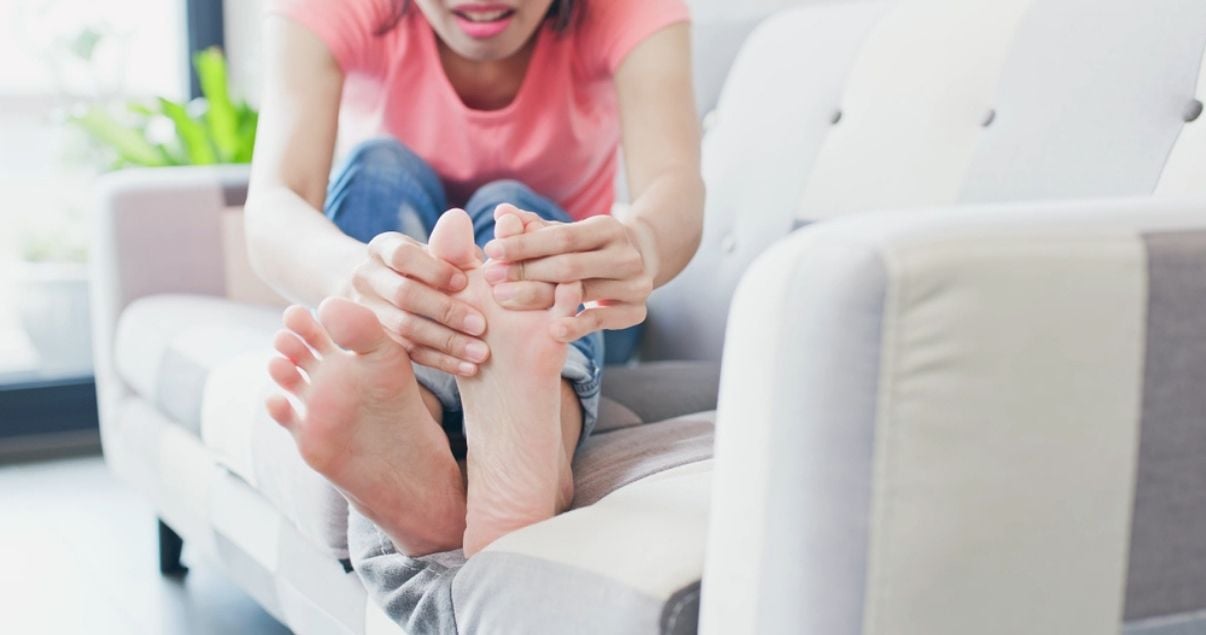 woman looking to incorporate better a foot care routine in order to keep athletes foot away