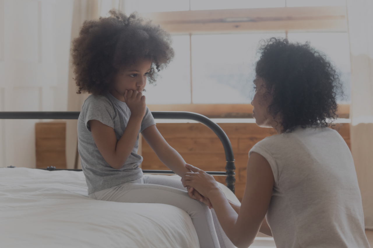 Worried mom hugging her daughter outdoors while thinking about ringworm infection